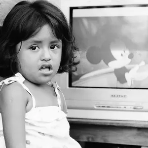 Girl watching animated Disney movie