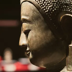 Profile of a Buddha statue with long earlobes