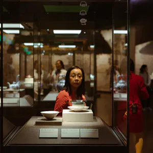 Woman standing in front of display