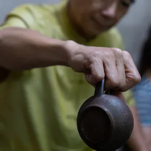 man pouring out Chinese tea