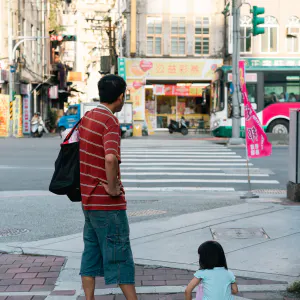 Father and daughter waiting at stoplights