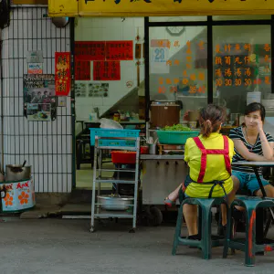 Two waiters at a table in the restaurant