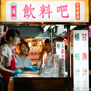 People around juice stand