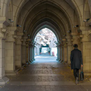 Man going through arch