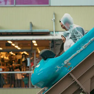 Father and kid on roller coaster