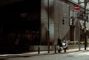 man and woman waiting at stoplights