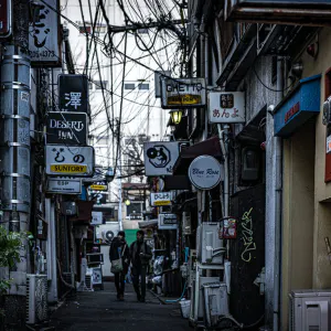 Many signboards in lane called Golden Gai