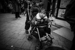 Little girl on baby buggy