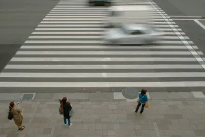 Three women at stoplight