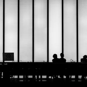 Silhouettes in cafe