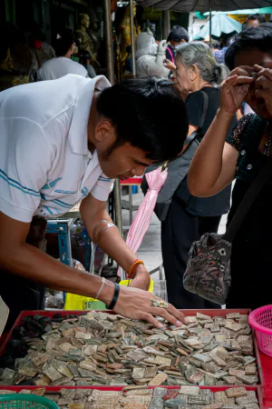 People scrutinizing Phra Kruang