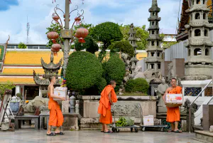 Monks carrying offerings