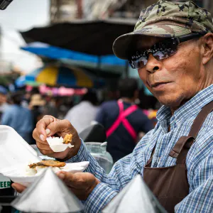 Street vendor having lunch