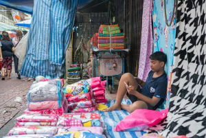 Man selling bedclothes