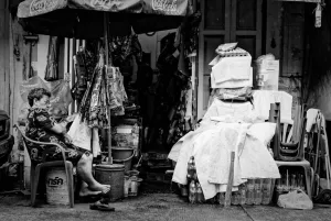 Woman sleeping in storefront