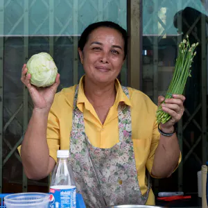 Woman having cabbage and chive