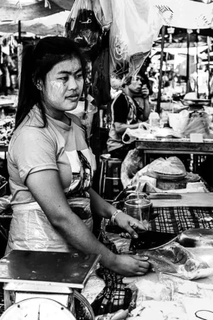 Woman working in butcher in Khlong Toei Market