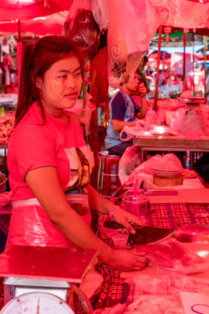 Woman working in butcher in Khlong Toei Market