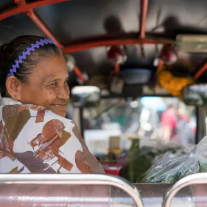 Older woman smiling in Tuktuk