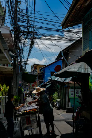 Stall in narrow lane with many electric wires