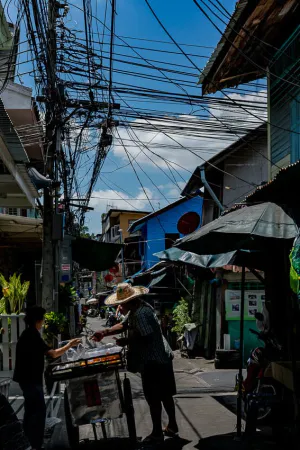 Stall in narrow lane with many electric wires