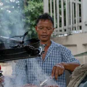 Man cooking meat