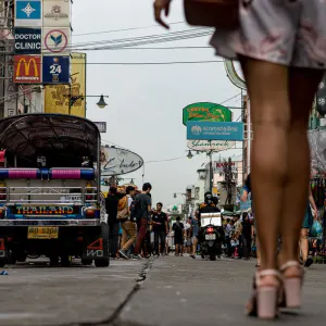 Slender legs walking through Khaosan Road