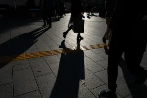 Silhouettes walking on Shinjuku Street