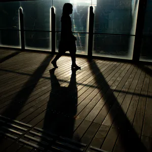 Silhouetted woman walking