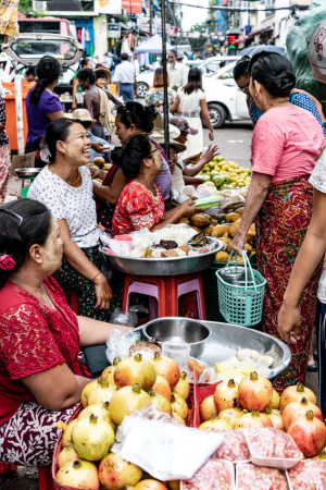 Vendors sharing private laugh with customers