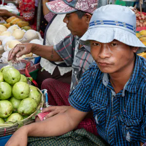 Man selling fruits in street market