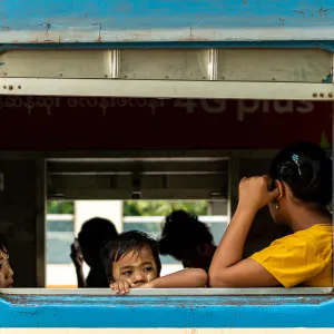 Parent and kids waiting for departure on train