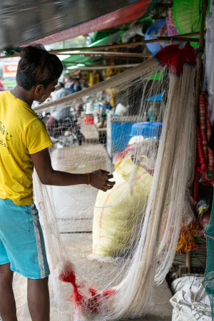 Man taking care of fishing net
