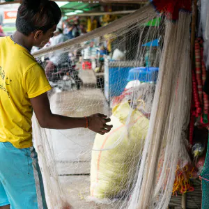 Man taking care of fishing net