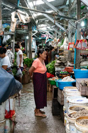Older woman standing in the fish section