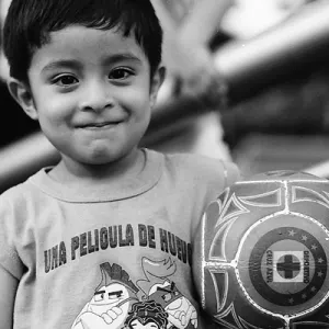 Boy holding football