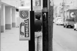 Man calling from pay phone