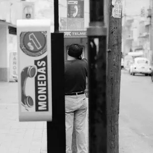 Man calling from pay phone
