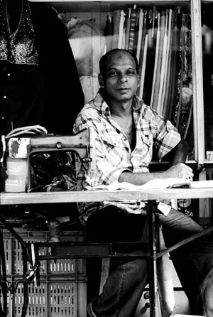 Man in front of sewing machine