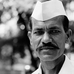 Man wearing Gandhi cap