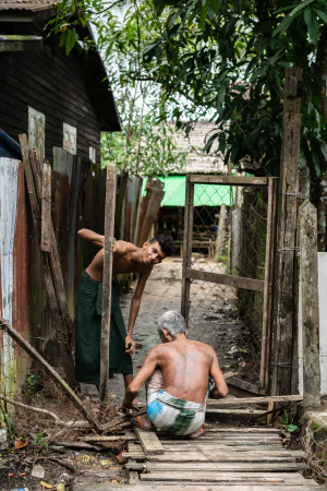 Men repairing gate