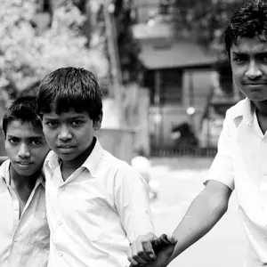 Three boys in street