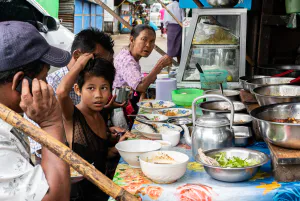 People eating at a food stall