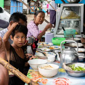 People eating at a food stall