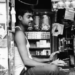 Man sitting in small shop