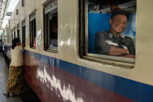 Smiling passenger and leave-taker on platform