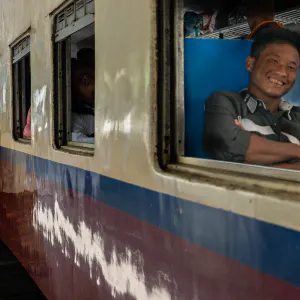 Smiling passenger and leave-taker on platform