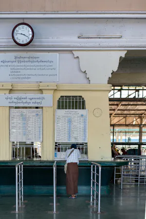 Man buying at ticket booth in Yangon Central Station