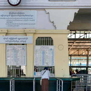 Man buying at ticket booth in Yangon Central Station