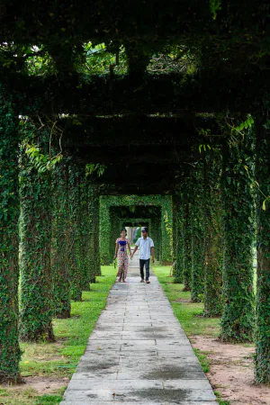 Couple walking hand in hand in Taukkyan War Cemetery